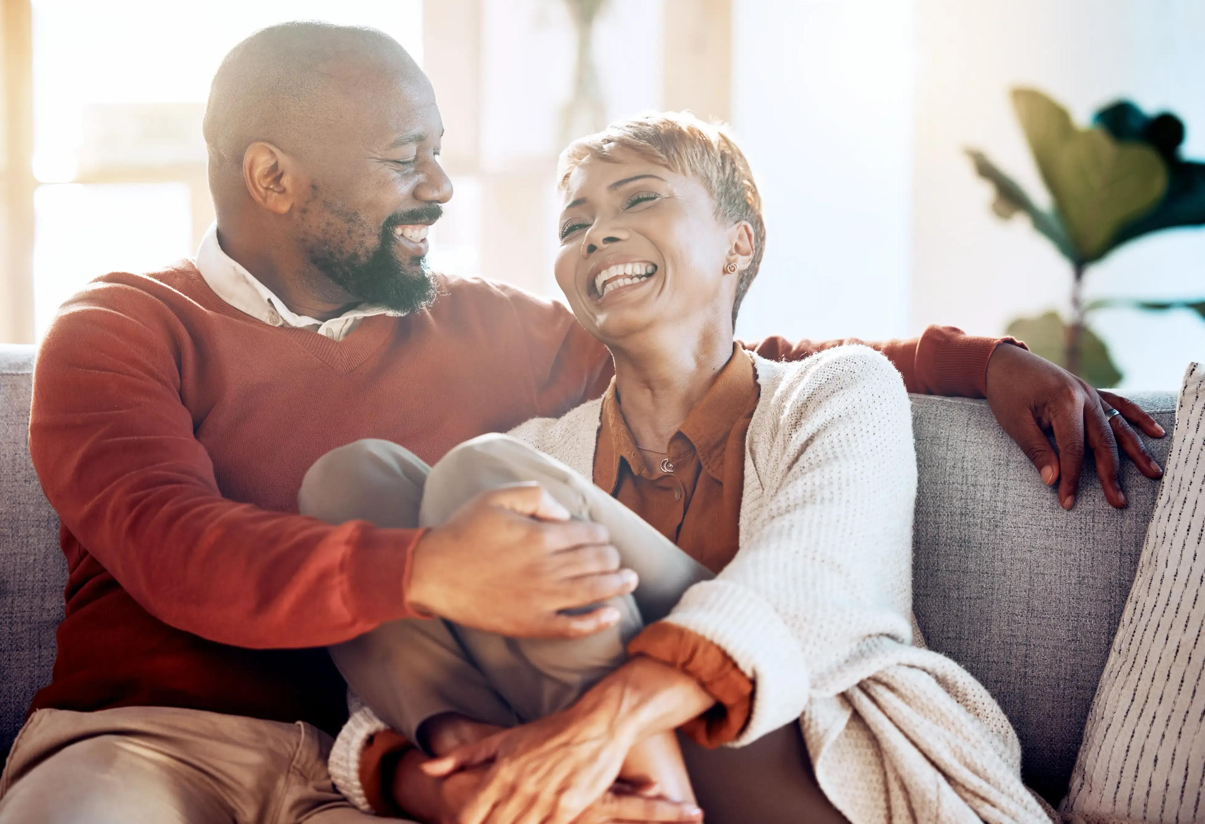 Smiling couple enjoying outdoor time, representing healthy living and wellness