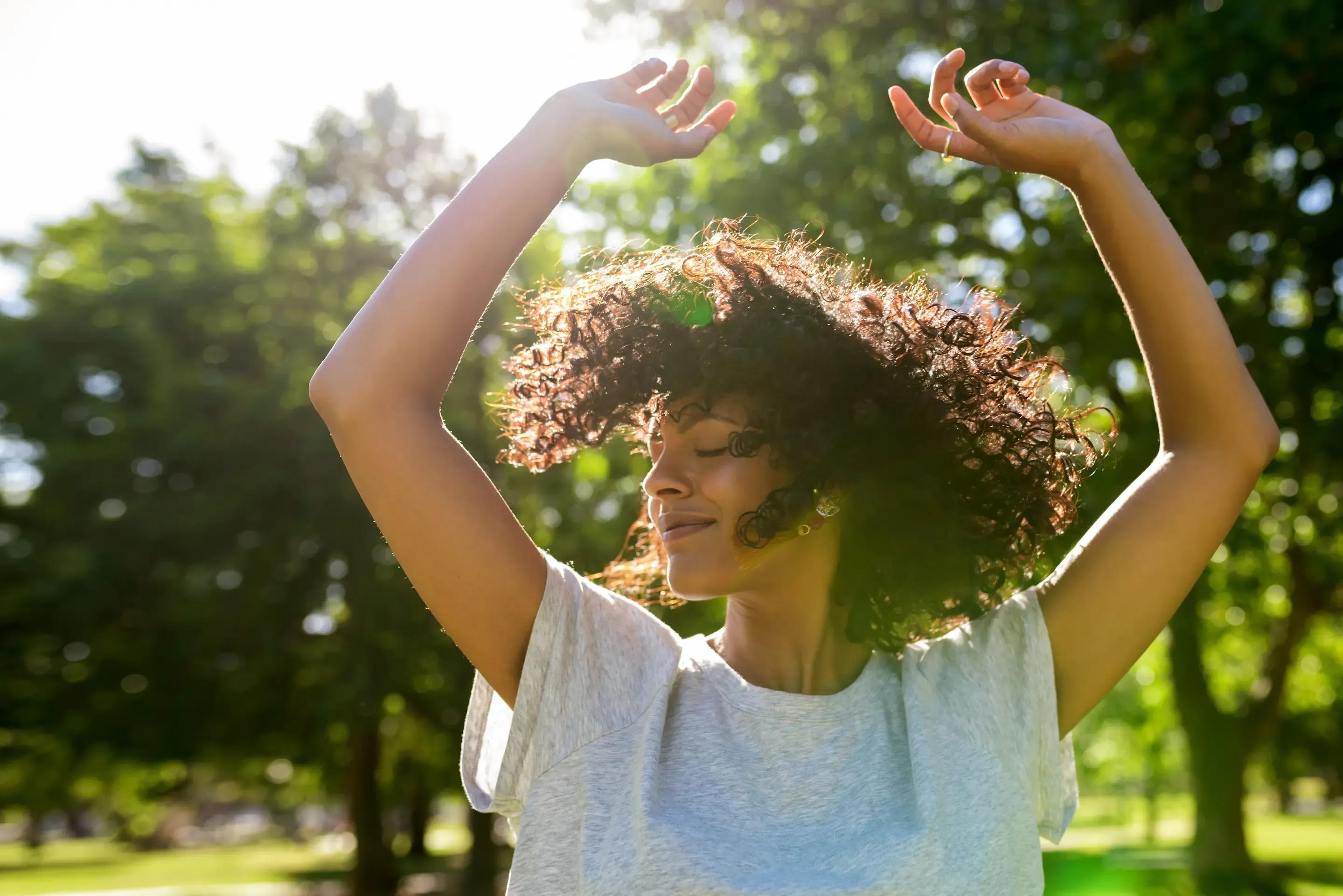 Woman smiling, representing confidence and well-being after health care